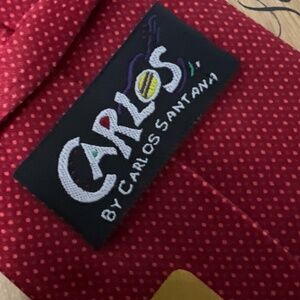 Carlos Santa Santana’s Music red tie